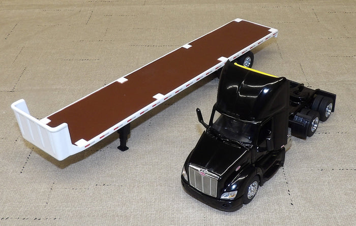 #84675 1/64 Black Peterbilt 579 with Flatbed Trailer, Cat 272D Skid Steer Loader & Pallet Boxes